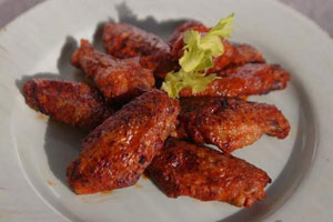 picture of several wings covered in sauce