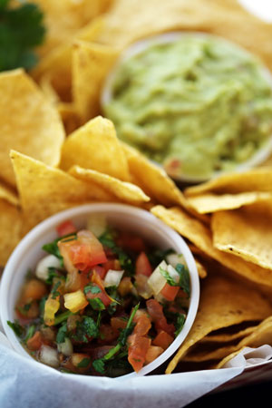 picture of tortila chips and a small sauce container