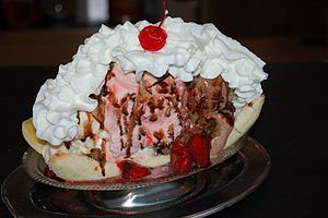 picture of a pile of ice cream with bananas and toppings