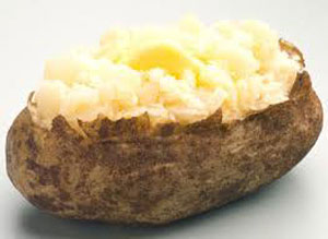 picture of a potato and split open with butter and sourcream