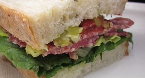 picture of a sandwich with salami, pepperoni, and lettuce