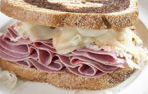 picture of a sandwich with corned beef, 1000 island, swiss, saukraut