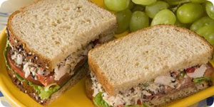 picture of a sandwich with tuna salad with lettuce and tomato