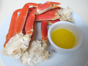 picture of a set of crab legs and melted butter