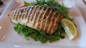 an entire whitefish fillet grilled with lemon